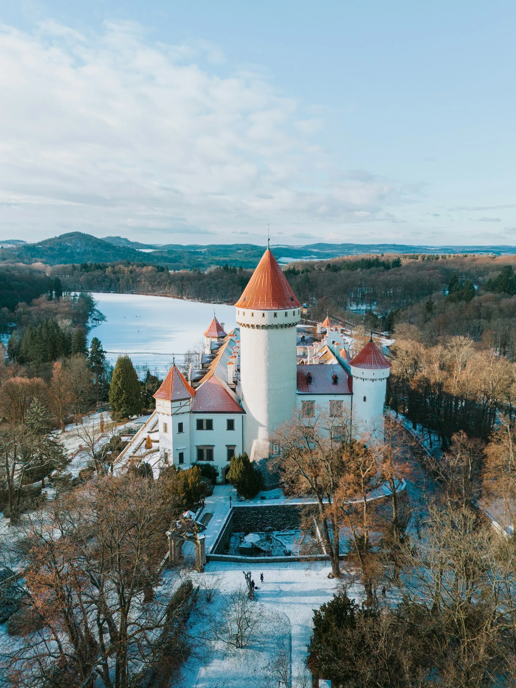 White château by a lake in autumn, from above