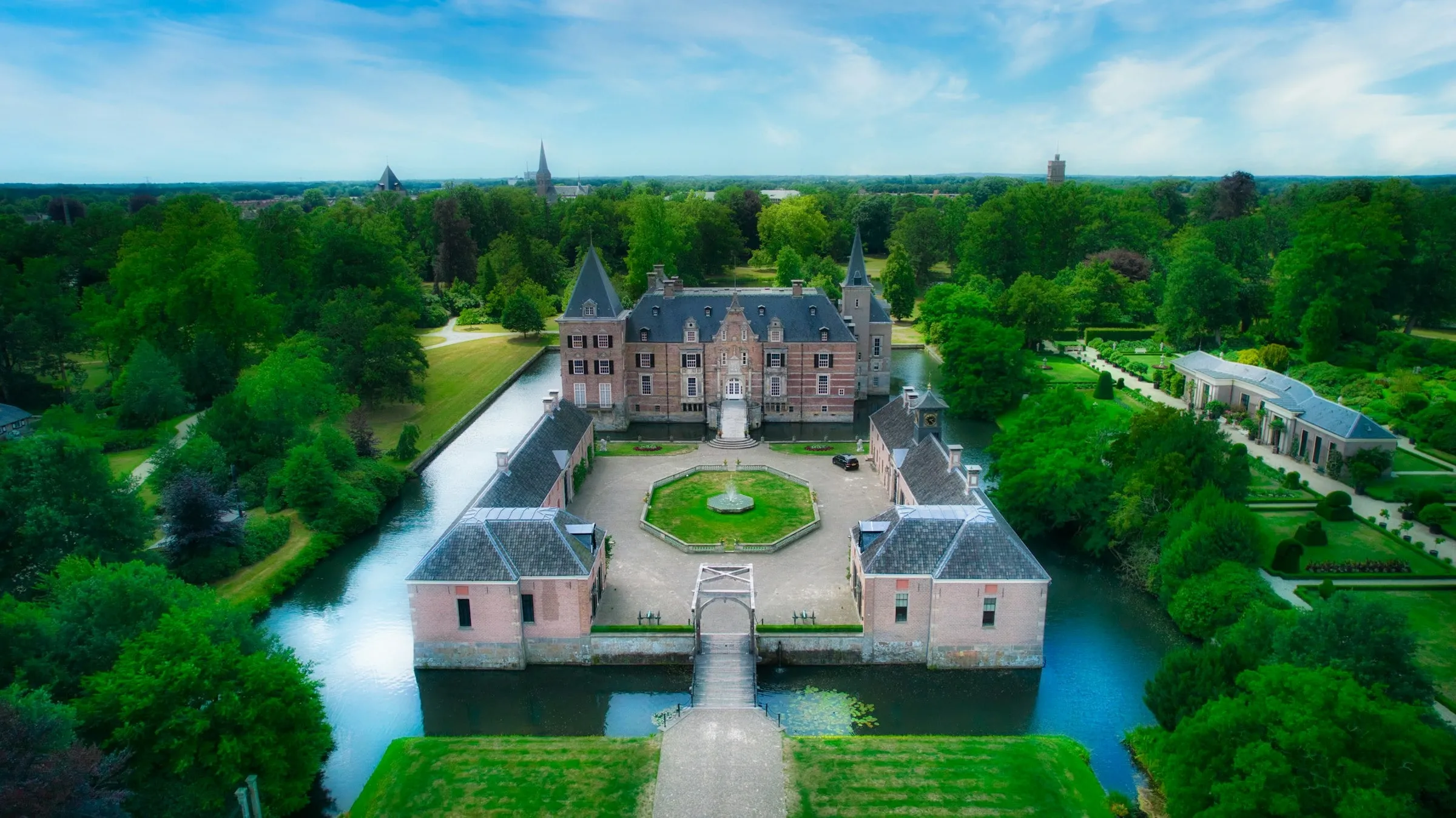 Moated château and gardens from above