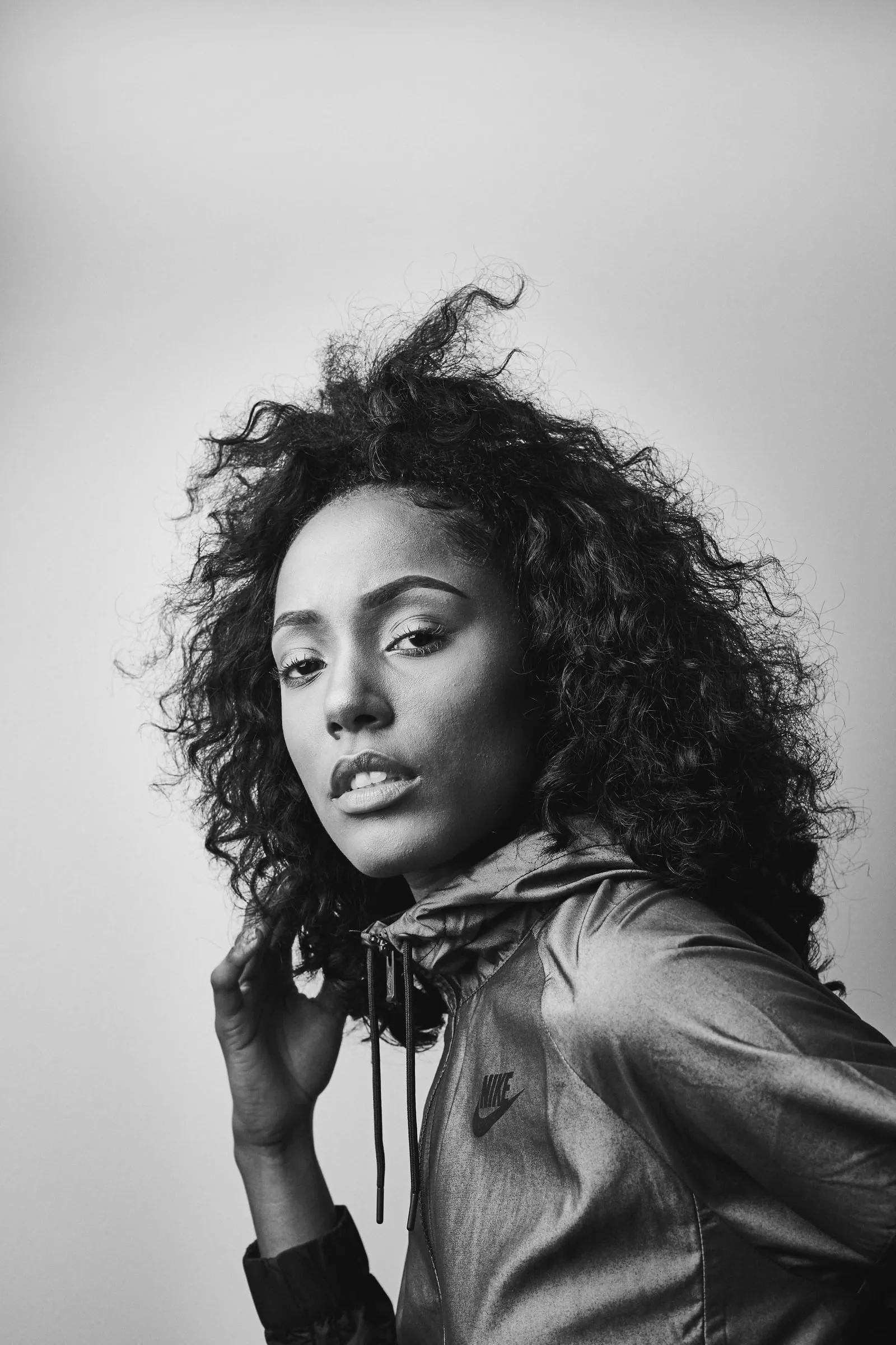Fashion portrait with curly hair, black and white